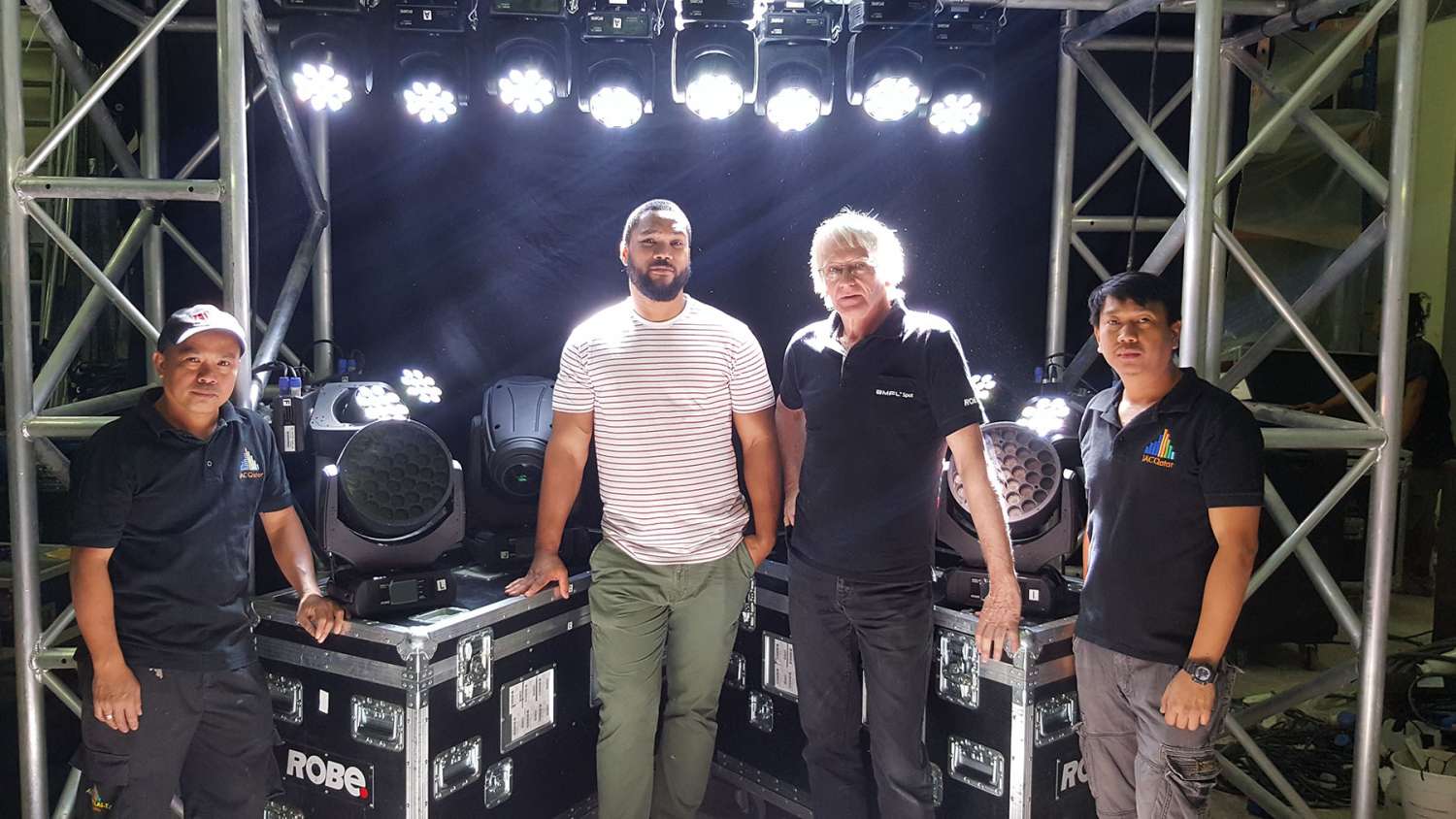 Lighting operator Joselito Del R Tablanza, Dion Da Costa - head of lighting at IAC-Qatar, Steve Eastham - international customer support from Robe lighting, and Angelito Miguel (lighting operator)