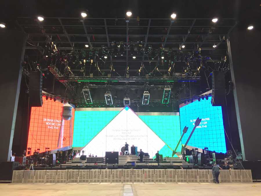 The set gives a strong Las Vegas feel consisting of large flown marquee arrows lined in neon The set gives a strong Las Vegas feel consisting of large flown marquee arrows lined in neon
