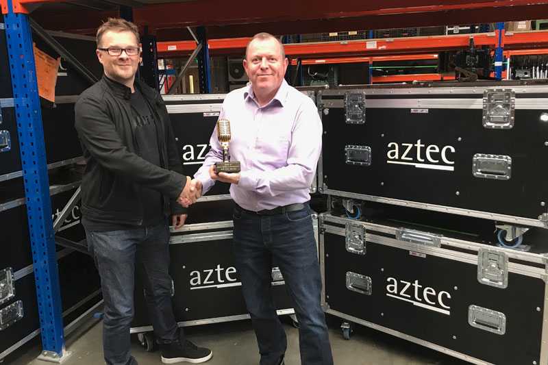 Stuart Moots of Shure hands the award to Aztec's Steve Colesell Stuart Moots of Shure hands the award to Aztec's Steve Colesell