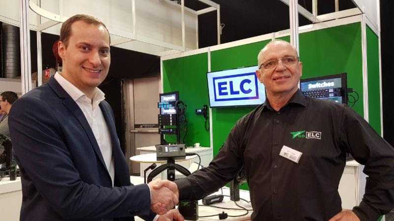 Dean Karov of MK Light Sound shakes hands on the deal with Silvio Cibien of Green-GO