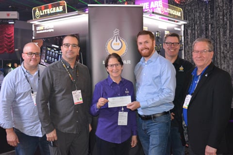 LiteGear’s Mike Bauman, Al DeMayo, Mike Wagner and Paul Royalty presenting the cheque to Lori Rubinstein and Rick Rudolph form Behind the Scenes