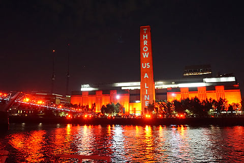 Clockwise from top left: Tate lit up for #WeMakeEvents and surrounded by supporters; Frank Turner performs to support the cause; attractions across the UK lit up red for the occasion; Protesters wearing red line up on Westminster Bridge. Photos: LSi