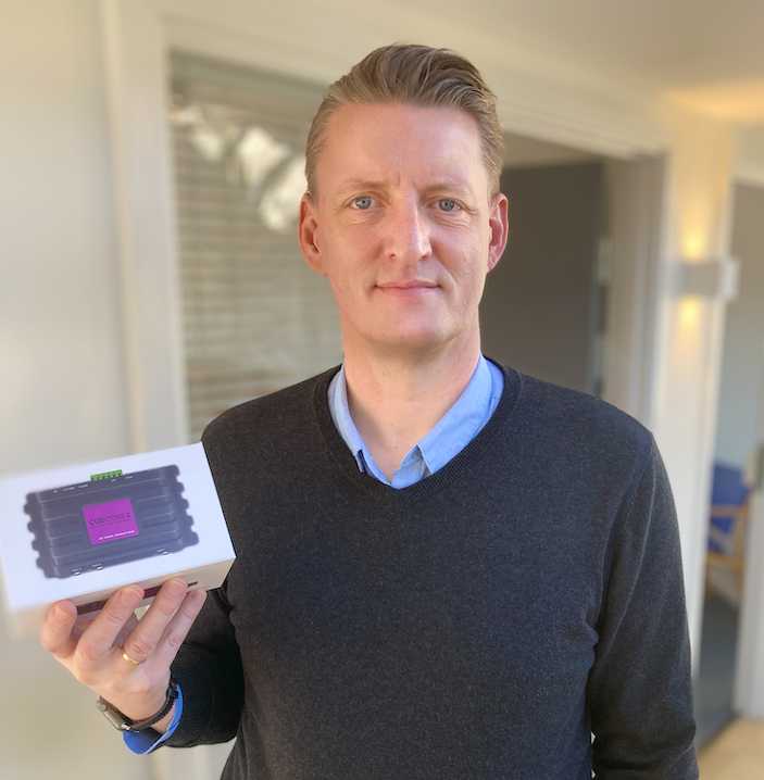 Urs Friis-Alstrup, sales manager of Matrix Sales, holding a CueCore2